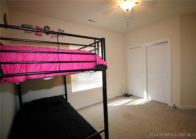 carpeted bedroom with ceiling fan