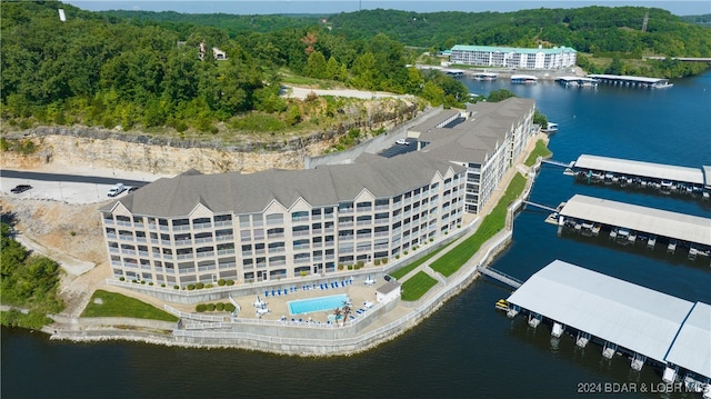 birds eye view of property with a water view