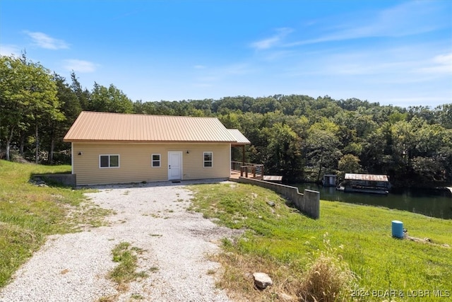 view of front of home featuring a water view and a front yard