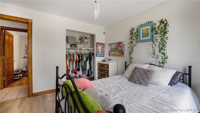 bedroom featuring a closet and light hardwood / wood-style flooring