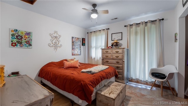 bedroom featuring ceiling fan and light hardwood / wood-style floors