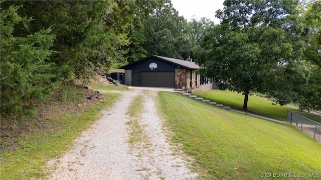 view of front of house featuring a front yard and a garage