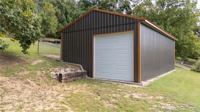 garage with a yard