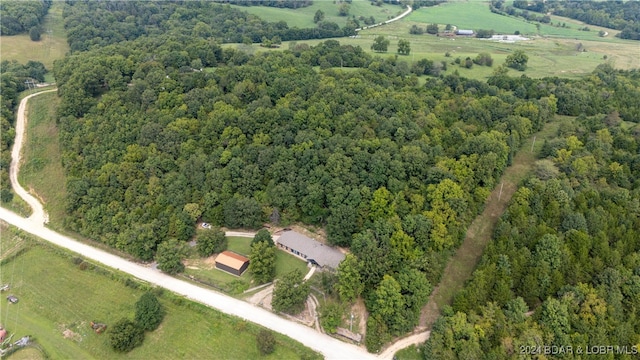 birds eye view of property featuring a rural view