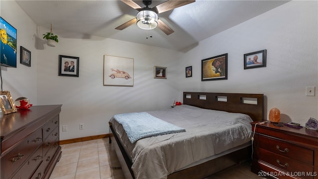 bedroom with ceiling fan and light tile patterned floors