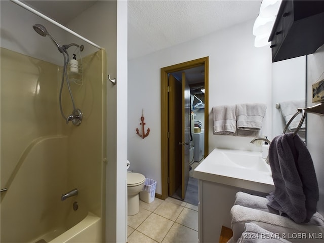 full bathroom featuring vanity, tile patterned floors, toilet, a textured ceiling, and shower / bath combination