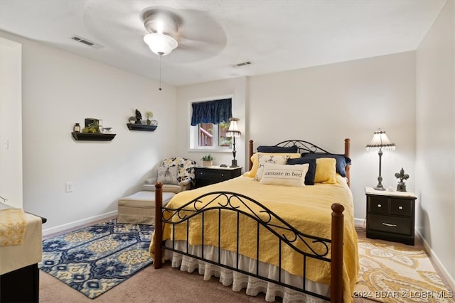 bedroom featuring ceiling fan and light colored carpet