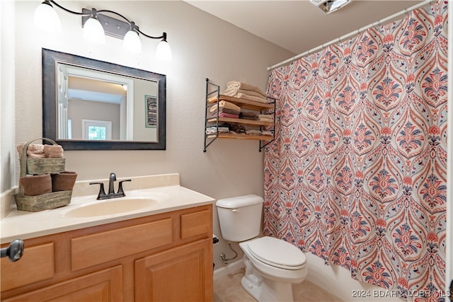 full bathroom featuring shower / bath combo, tile patterned floors, vanity, and toilet