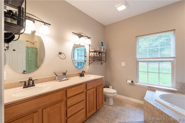 full bathroom featuring vanity, separate shower and tub, toilet, and a wealth of natural light