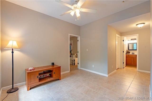 interior space with ceiling fan and light tile patterned floors