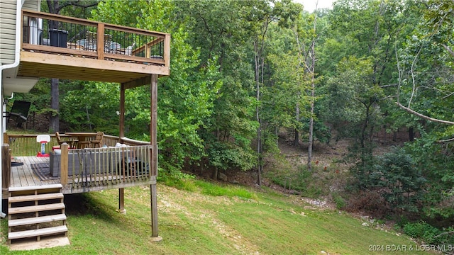 view of yard with a wooden deck