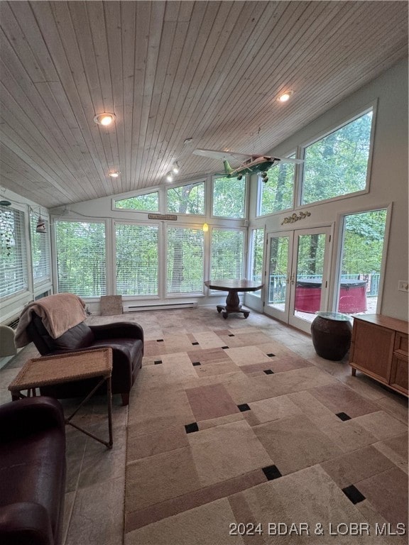 sunroom with vaulted ceiling, wood ceiling, and french doors