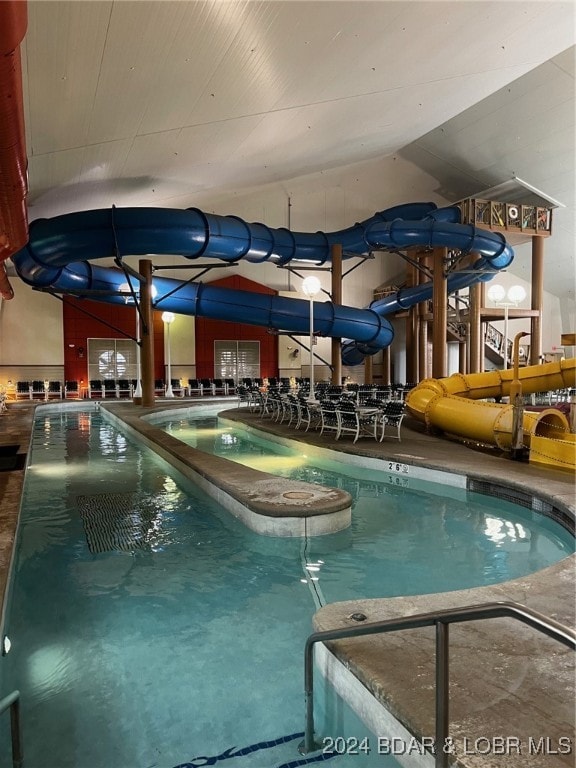 view of pool featuring a water slide