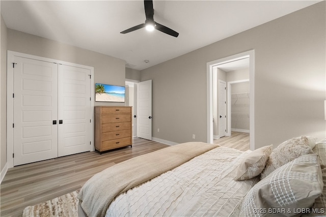 1184 Jeffries Rd Unit 519, Osage Beach, MO 65065 - bedroom featuring light wood-type flooring, a closet, connected bathroom, and ceiling fan