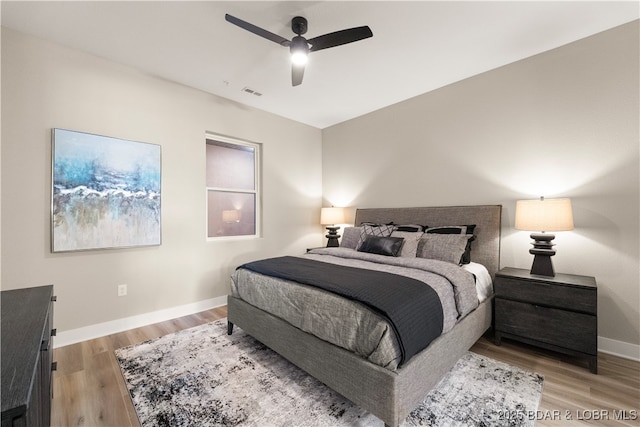 1184 Jeffries Rd Unit 519, Osage Beach, MO 65065 - bedroom with light wood finished floors and ceiling fan