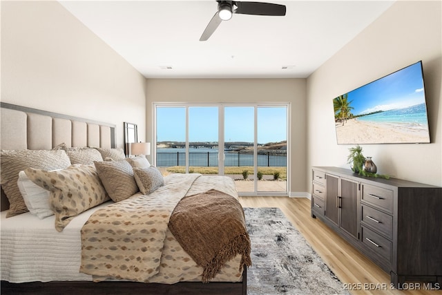 bedroom featuring visible vents, access to outside, light wood-style floors, baseboards, and ceiling fan