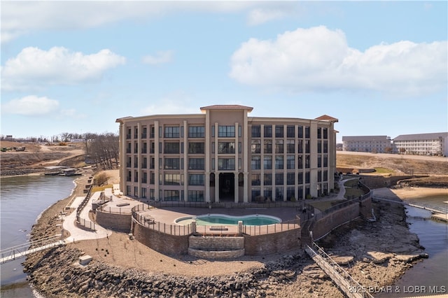view of building exterior with a water view