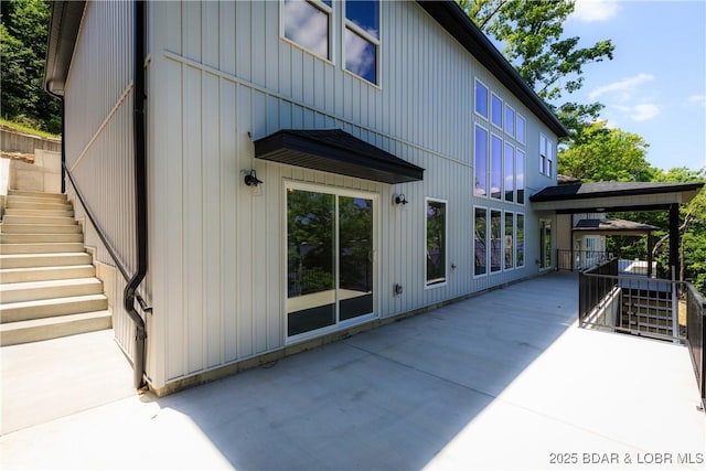 17023 Seminole Dr W, Rocky Mount, MO 65072 - back of property with stairs and a patio