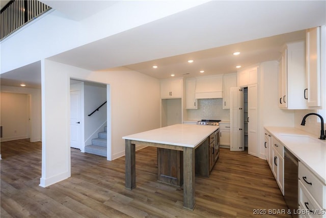 17023 Seminole Dr W, Rocky Mount, MO 65072 - kitchen featuring white cabinetry, dark wood-style floors, recessed lighting, tasteful backsplash, and light countertops