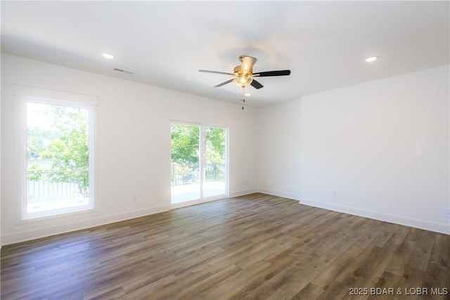 17023 Seminole Dr W, Rocky Mount, MO 65072 - spare room featuring wood finished floors, a ceiling fan, and recessed lighting