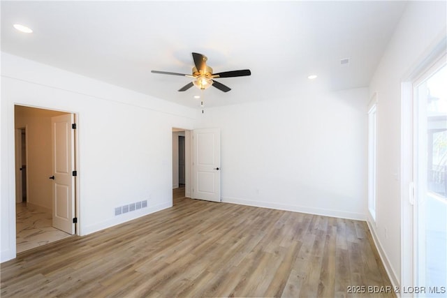17023 Seminole Dr W, Rocky Mount, MO 65072 - unfurnished room with light wood-type flooring, ceiling fan, and recessed lighting