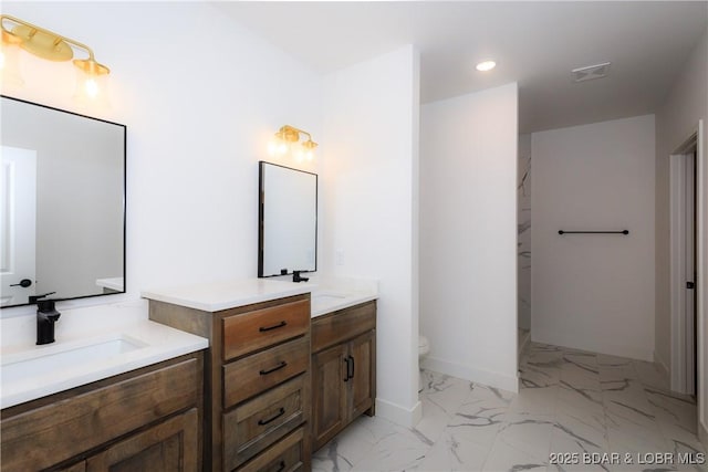 17023 Seminole Dr W, Rocky Mount, MO 65072 - bathroom with recessed lighting, marble finish floors, and two vanities
