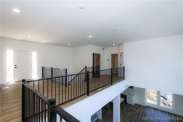 17023 Seminole Dr W, Rocky Mount, MO 65072 - hall with an upstairs landing, wood finished floors, and recessed lighting