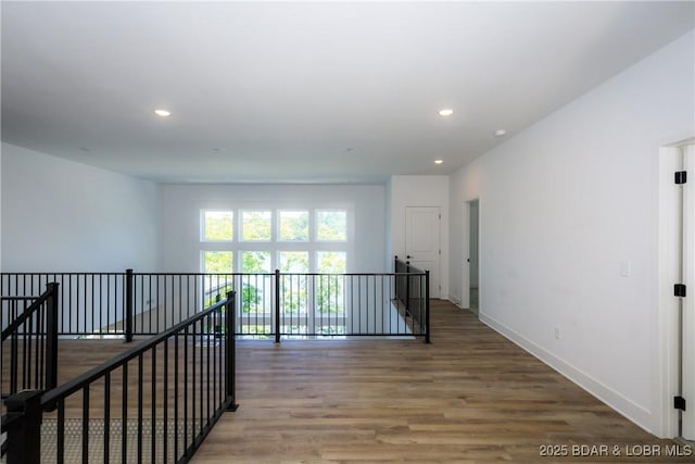 17023 Seminole Dr W, Rocky Mount, MO 65072 - hallway featuring an upstairs landing, wood finished floors, and recessed lighting