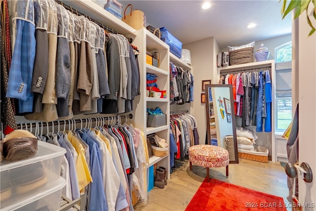 spacious closet featuring light hardwood / wood-style floors