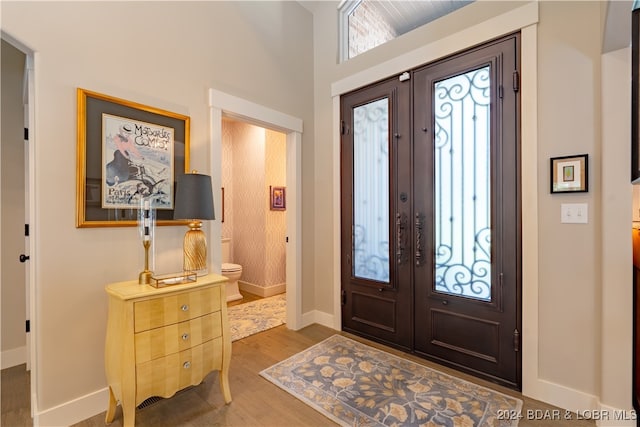 entrance foyer with wood-type flooring and french doors