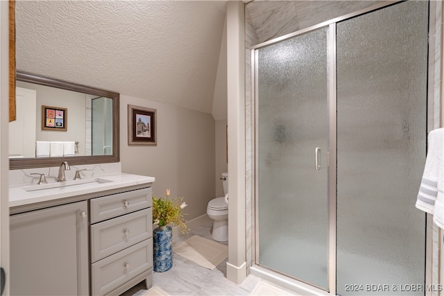 bathroom with vanity, toilet, and an enclosed shower