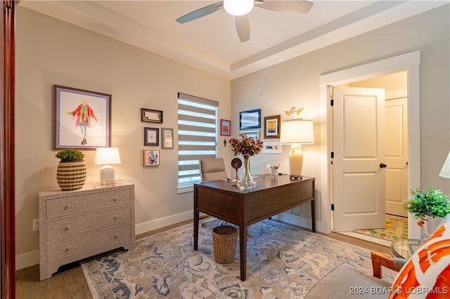 home office with ceiling fan and hardwood / wood-style flooring