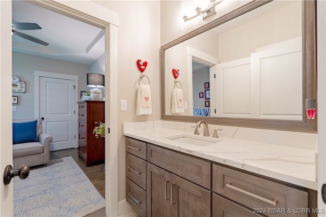 bathroom featuring vanity, ceiling fan, and hardwood / wood-style floors