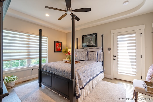 bedroom with ceiling fan and light hardwood / wood-style floors