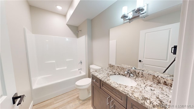 full bathroom featuring toilet, shower / bathing tub combination, vanity, and wood-type flooring