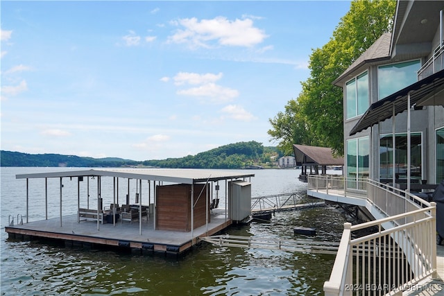 view of dock with a water view