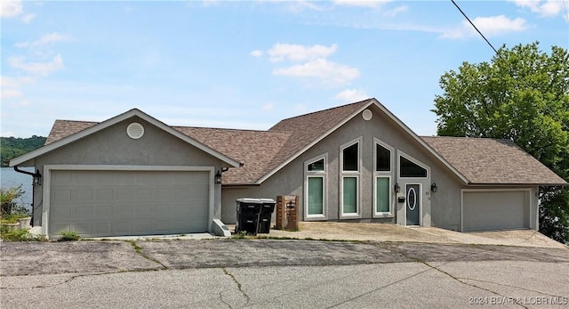 ranch-style home featuring a garage