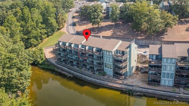 birds eye view of property featuring a water view