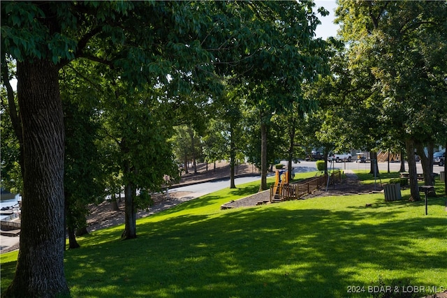 surrounding community featuring a yard