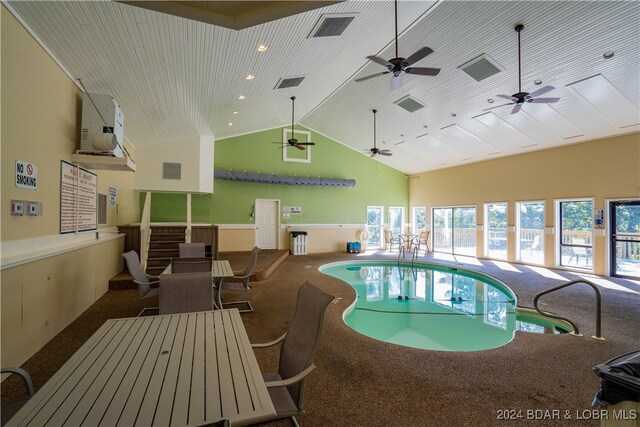 view of swimming pool with a jacuzzi and ceiling fan