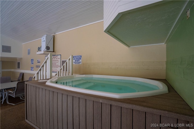 view of swimming pool featuring an indoor in ground hot tub