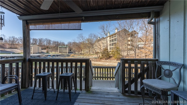 wooden deck with ceiling fan