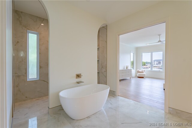 bathroom with independent shower and bath, vanity, hardwood / wood-style floors, and ceiling fan