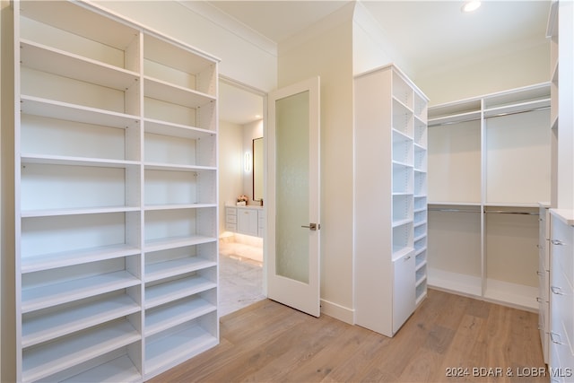 spacious closet featuring light wood-type flooring