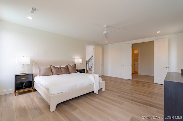 bedroom featuring ceiling fan and light wood-type flooring