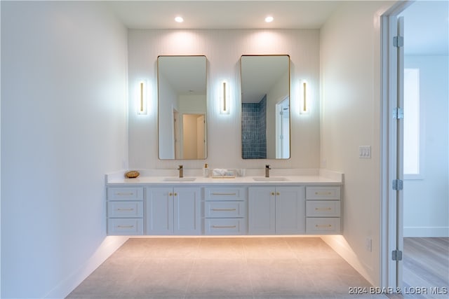 bathroom featuring hardwood / wood-style flooring and vanity