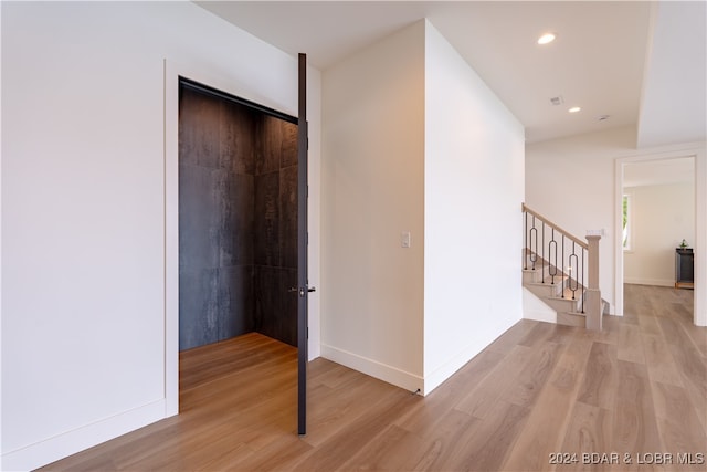 hall with light wood-type flooring