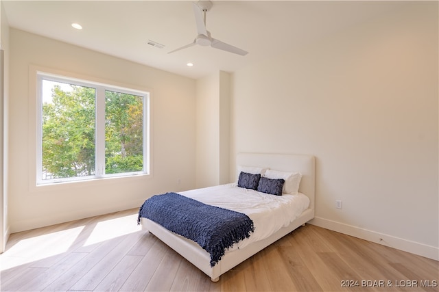 bedroom featuring light hardwood / wood-style floors and ceiling fan