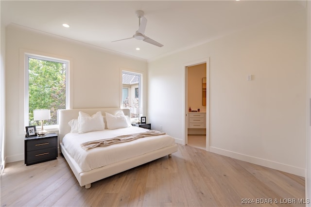 bedroom with ceiling fan, light hardwood / wood-style flooring, and ensuite bathroom