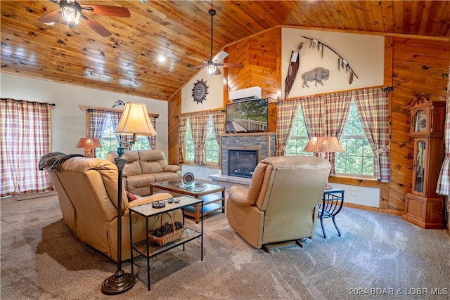 living room with wood ceiling, carpet floors, wood walls, ceiling fan, and a stone fireplace